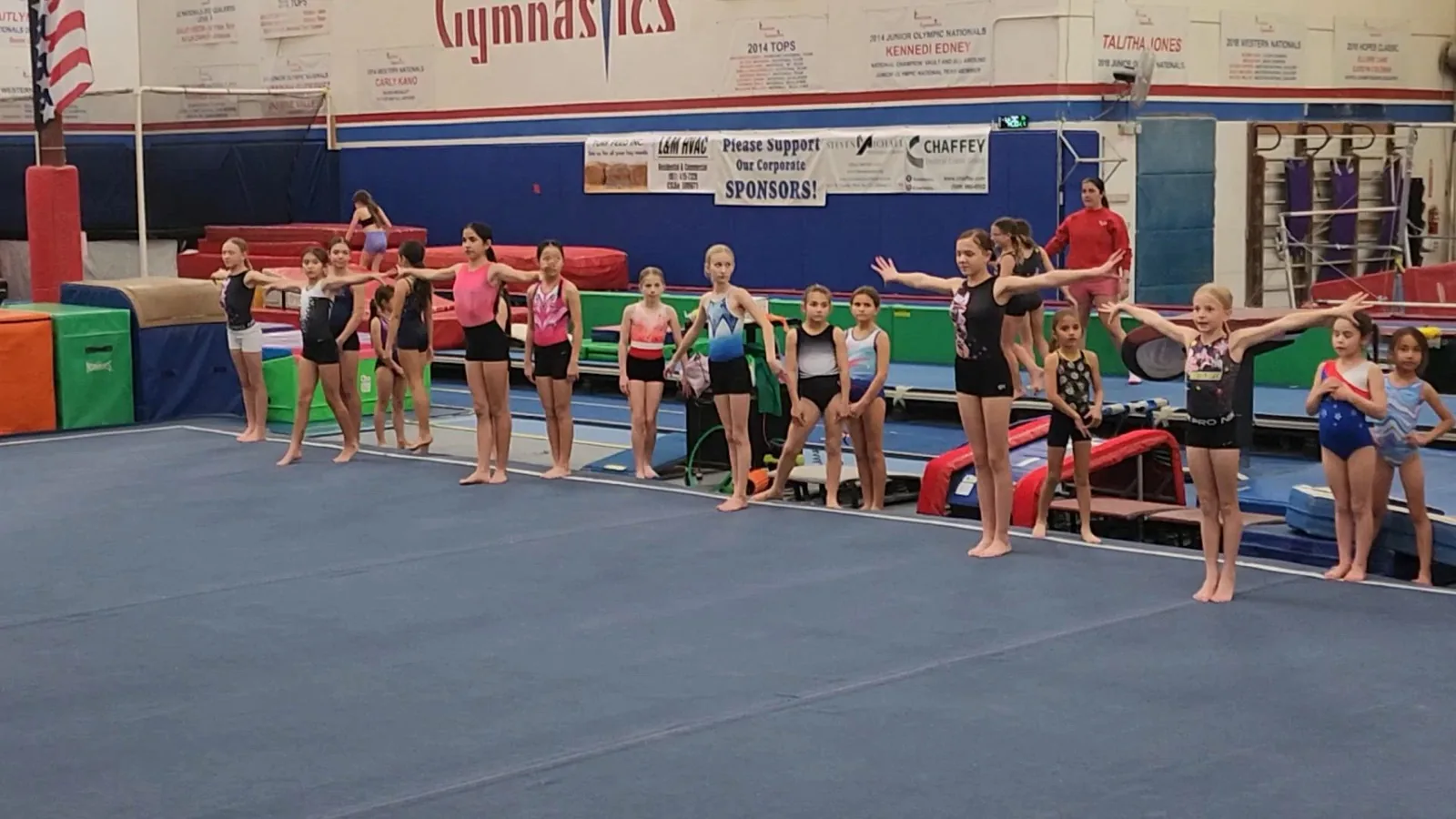 An Academy class lined up on the floor
